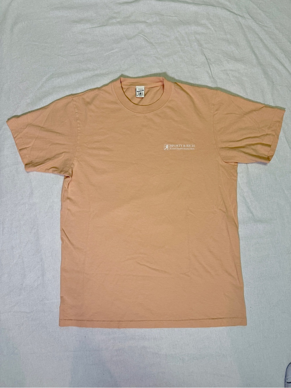 Sporty & Rich Good Health Starts Here Peach Short Sleeve Crewneck Tee